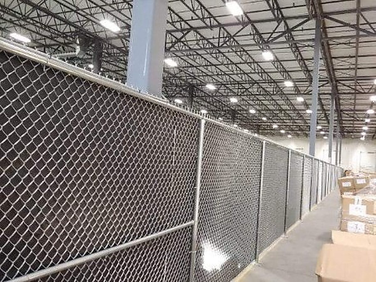 Galvanized chain link partition and gate inside a commercial building